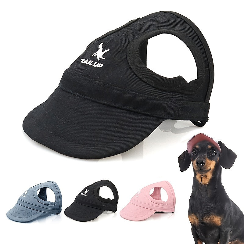 TailUp dog baseball cap in black, with the TailUp logo on the front, ear holes and a chin strap. Colour options and a dachshund wearing one shown alongside.