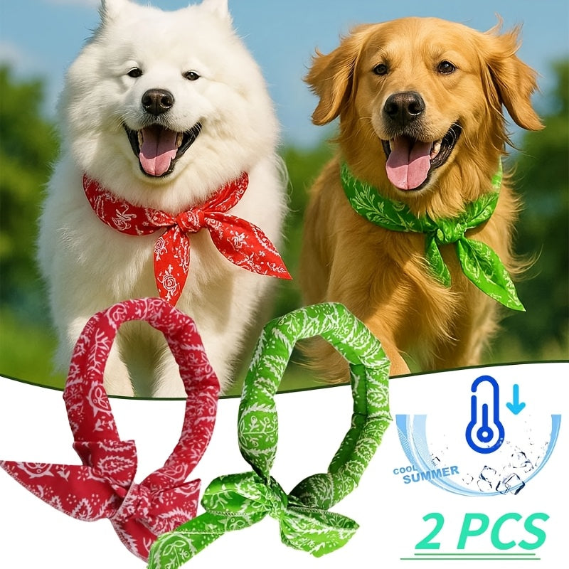 Two dogs wearing green and red leaf print cooling bandanas